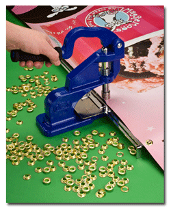 hand press for inserting solid brass grommets onto banners and posters